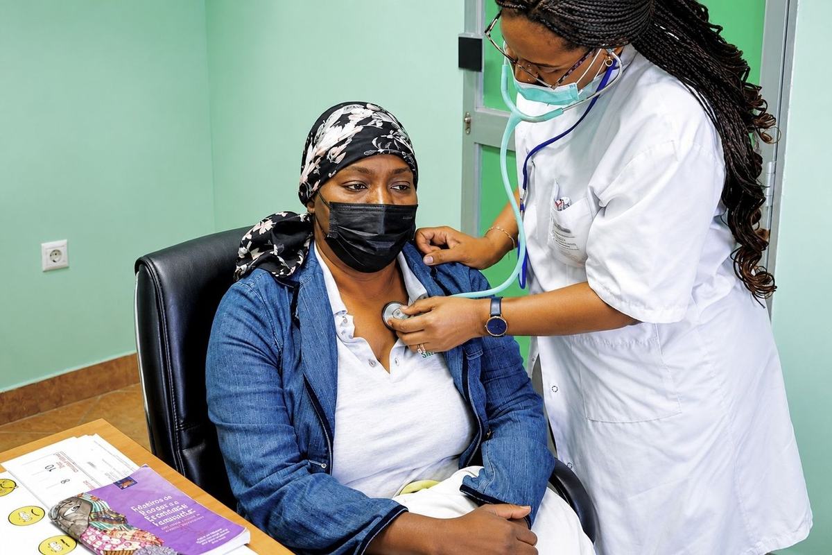 A medical consultation forms part of support addressing a woman's physical, emotional and family needs.